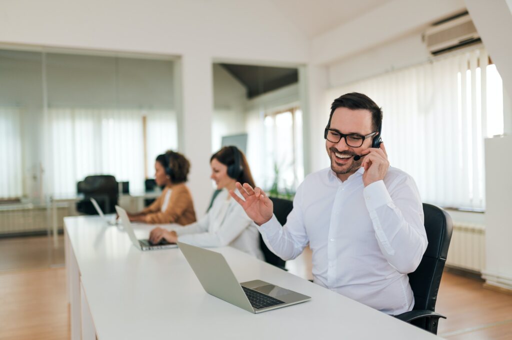 Positive sales agent at work, portrait.